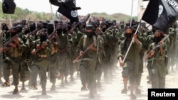 New recruits belonging to Somalia's al-Qaeda-linked al Shabaab rebel group march at a military training base in Afgoye, west of the capital Mogadishu. (file)