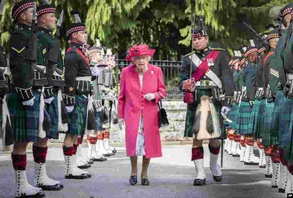 Britain&#39;s Queen Elizabeth II is seen during an inspection of the Balaklava Company, 5 Battalion The Royal Regiment of Scotland at the gates at Balmoral, Scotland, as she spends the summer at the castle.