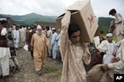 Supplies are distributed to 400 families in Pakistan's Swat valley. All of them lost their homes to flooding in 2010.