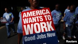 People march in the Charlotte Labor Day Parade in Charlotte, North Carolina September 3, 2012. 