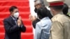 Myanmar's junta chief Senior General Min Aung Hlaing (L) gestures as he is welcomed upon his arrival ahead of the ASEAN leaders' summit, at the Soekarno Hatta International airport in Tangerang, on the outskirts of Jakarta, Indonesia, April 24, 2021. Cour