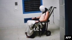 This frame grab from Australian Broadcasting Corporation's (ABC) Four Corners program broadcast in Australia on July 25, 2016, and released on July 26, 2016, allegedly shows a teenage boy hooded and strapped into a chair at a youth detention center in the Northern Territory city of Darwin. 
