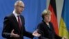 Merkel: Sanctions on Russia Stay Until Fighting Stops in Ukraine