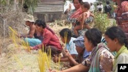 A group of villagers lit incense, in Kampong Speu province.
