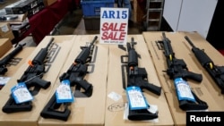 FILE - AR-15 rifles are displayed for sale at a gun show in Pennsylvania, Oct. 6, 2017. (REUTERS/Joshua Roberts)