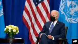 President Joe Biden meets with United Nations Secretary-General Antonio Guterres (not seen) at the Intercontinental Barclay Hotel during the United Nations General Assembly, Sept. 20, 2021, in New York. 