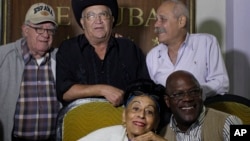 FILE - Remaining members of Cubaís Buena Vista Social Club band, Omara Portuondo, Jesus Aguaje Ramos, Luis Manuel Guajiro Mirabal, Eliades Ochoa, and Barbarito Torres pose for a picture after a press conference at the Hotel Nacional in Havana, Jan. 24, 2014.