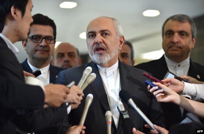 Iranian Foreign Minister Mohammad Javad Zarif, center, answers questions after a meeting with Japanese Foreign Minister Taro Kono at the foreign ministry in Tokyo, May 16, 2019.