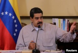 Venezuela's President Nicolas Maduro speaks during a meeting with ministers and pro-government governors in Caracas, Sept. 25, 2017.