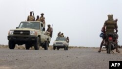 Sudanese fighters battling alongside Yemen's Saudi-backed pro-government forces against Huthi rebels gather on June 7, 2018, near the city of Al Jah in the Hodeida province, 50 kilometres from the port city of Hodeida, which the Iran-backed Huthi insurgents seized in 2014.