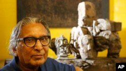 India's Balkrishna Doshi who won the 2018 Pritzker Architecture Prize sits for a photo at his home in Ahmadabad, India, Wednesday, March 7, 2018. (AP Photo/Ajit Solanki)