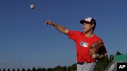 In this June 23, 2017 photo, right-handed pitcher Eric Pardinho practices in Ibiuna, Brazil. (AP Photo/Andre Penner) 