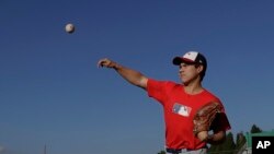 In this June 23, 2017 photo, right-handed pitcher Eric Pardinho practices in Ibiuna, Brazil.