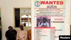 A poster announcing a reward for the capture of Boko Haram leader Abubakar Shekau is seen on a wall in Baga village on the outskirts of Maiduguri in the north-eastern Nigerian state of Borno.