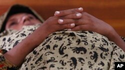 FILE - Sughra Ramzan, who is pregnant, waits for a doctor at Muzaffargarh District Hospital's maternity ward in Punjab province, Pakistan. Pakistan has the highest rates of stillbirths at 43.1 per 1,000 total births, followed by nine sub-Saharan countries.