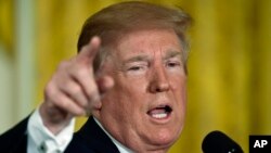 President Donald Trump speaks in the East Room of the White House in Washington, June 18, 2018. 