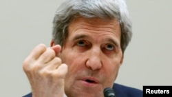 John Kerry dalam sidang Kongres (13/3). (Reuters/Yuri Gripas)