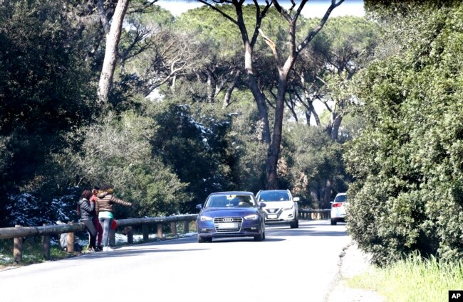 Silvia, Cherin, Giulia, from Nigeria, work in the Castel Porziano wood, in the outskirts of Rome, Feb. 27, 2018. Nigerian teenagers and young women selling sex is a common sight for motorists in Italy.