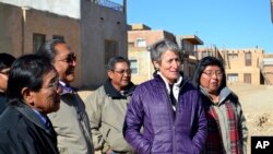 FILE - U.S. Interior Secretary Sally Jewell, second from right, tours Acoma Pueblo, a nearly thousand-year-old village that's situated atop a New Mexico mesa, with tribal leaders on Thursday, Dec. 8, 2016.
