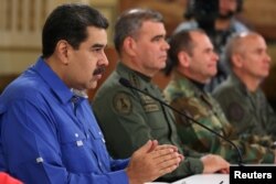 Venezuela's President Nicolas Maduro speaks during a broadcast with members of the government and military high command members at Miraflores Palace in Caracas, Apr. 30, 2019. (Miraflores Palace handout)