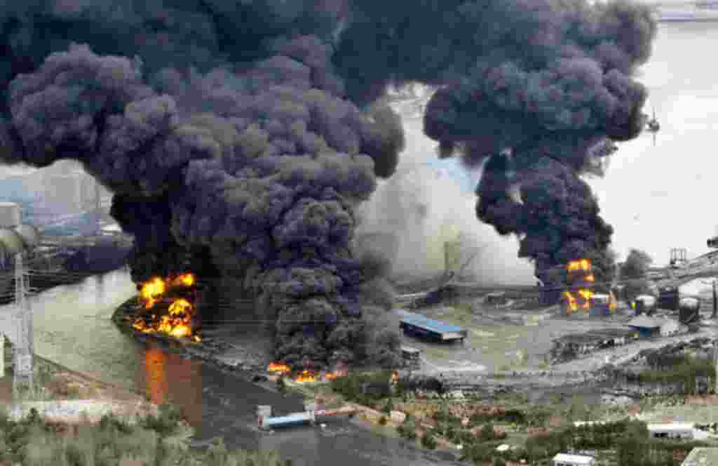 A factory facility burns following an earthquake and tsunami in Sendai, northeastern Japan March 12, 2011. Japan confronted devastation along its northeastern coast on Saturday, with fires raging and parts of some cities under water after a massive earthq