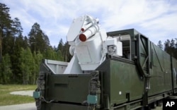 In this video grab provided by RU-RTR Russian television via AP television on March 1, 2018, a Russian military truck with a laser weapon mounted on it is shown at an undisclosed location in Russia.