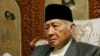 FILE - Former Indonesian dictator Suharto sits in his home in Jakarta, Oct. 24. 2006. 