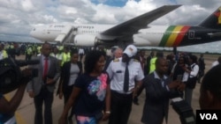 Bona Mugabe Chikore and her husband, Simba Chikore, at the Robert Gabriel Mugabe International Airport on Wednesday.