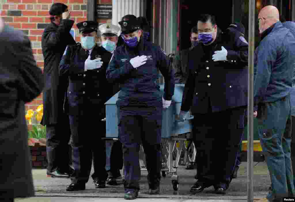 Members of the New York City paramedic community escort the casket of their colleague Anthony &quot;Tony&quot; Thomas in the Bay Ridge area of Brooklyn.