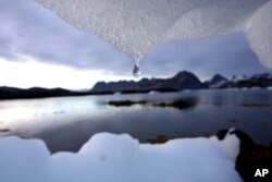 FILE - An iceberg melts near the arctic circle, Kulusuk, Greenland.