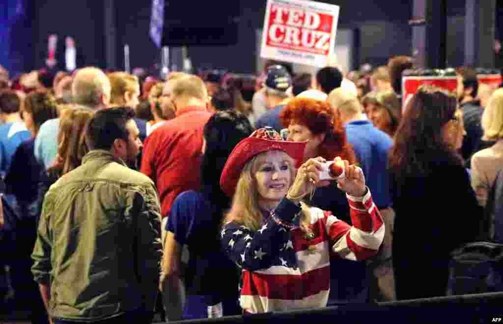 People attend a rally by Republican presidential candidate Sen. Ted Cruz (R-TX) at Gilley's Dallas the day before Super Tuesday in Dallas, Texas, Feb. 29, 2016.