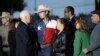 Vice President Mike Pence and his wife, Karen, talk with Johnnie Langendorff, and his girlfriend Summer Caddell, third from right, as they visit with first responders, family, friends and victims outside the Sutherland Spring Baptist Church, Nov. 8, 2017.