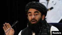 FILE - Taliban spokesman Zabihullah Mujahid speaks during a news conference in Kabul, Afghanistan Sept. 6, 2021.