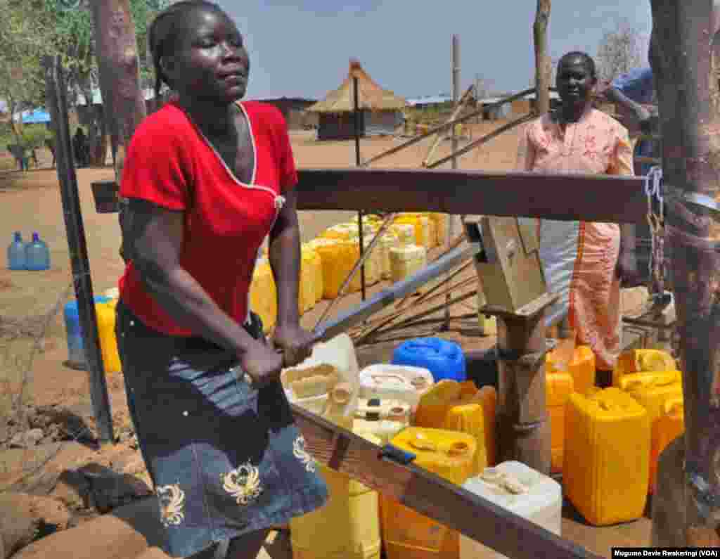 A young South Sudanese woman pumps water at a borehole in Gudere, near Juba, in South Sudan. The South Sudanese capital has grown from population of around 60,000 in 2005 to nearly 400,000 in 2011. The city’s water resources have not been able to keep up.
