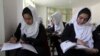 FILE - Girls are seen attending class at a school run by Aid Afghanistan for Education in Kabul, May 2014.