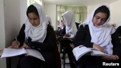 FILE - Girls are seen attending class at a school run by Aid Afghanistan for Education in Kabul May 13, 2014.