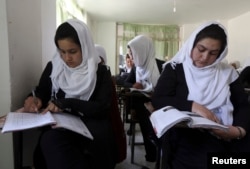 FILE - Girls are seen attending class at a school run by Aid Afghanistan for Education in Kabul May 13, 2014.