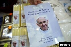 Merchandise with a picture of Pope Francis on it is seen for sale at a stall during during the Papal Congress at the World Meeting of Families in Dublin, Ireland, Aug. 21, 2018.