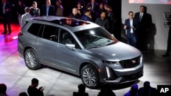 A three-row Cadillac XT6 crossover SUV is shown after being unveiled during media previews for the North American International Auto Show in Detroit, Sunday, Jan. 13, 2019.