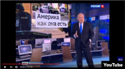In this YouTube screen grab, Dmitry Kiselyov discusses the recent police shooting in Dallas on his weekly news review program Vesti Nedeli on Moscow Rossiya TV, July 10, 2016.