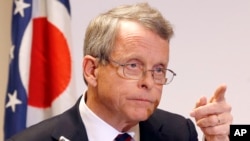 FILE – A report by Ohio Attorney General Mike DeWine criticizes how Planned Parenthood disposes of fetal remains. He’s shown at a 2013 news conference.