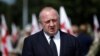 FILE - Georgia's President Giorgi Margvelashvili speaks to media after a ceremony at the memorial cemetery of the Georgian soldiers killed during the war with Russia over the breakaway region of South Ossetia in 2008 in Tbilisi, Georgia, Aug. 8, 2017.