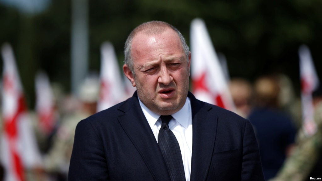 FILE - Georgia's President Giorgi Margvelashvili speaks to media after a ceremony at the memorial cemetery of the Georgian soldiers killed during the war with Russia over the breakaway region of South Ossetia in 2008 in Tbilisi, Georgia, Aug. 8, 2017.