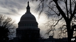 The U.S. Capitol is silhouetted at day's end in Washington, Tuesday, Feb. 14, 2017.