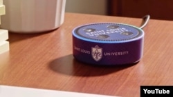 The Alexa Echo Dot devices include the official Saint Louis University logo and are equipped with specific skills to provide information on local events and campus life. (Screengrab for Saint Louis University Video)