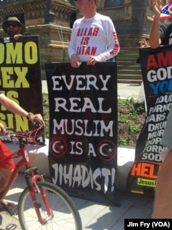 Jim Gilles of Evansville, Indiana, said he is a born-again Christian and joined a small group of people from around the country protesting Islam, in the Public Square in downtown Cleveland, July 18, 2016.