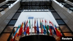 Flags are seen inside the European Council headquarters on the eve of a EU Summit in Brussels, Belgium, Dec. 14, 2016. 
