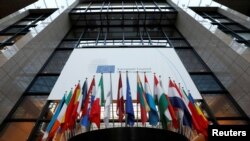 Flags are seen inside the European Council headquarters on the eve of a EU Summit in Brussels, Belgium, Dec. 14, 2016. 