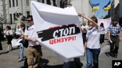 Ukrainian journalists carry a poster reading "Stop Censorship!" during a demonstration in Kiev, Ukraine, in 2010.