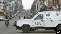 FILE - United Nations peacekeepers patrol Monrovia streets during Liberia's last presidential election runoff, Nov. 8, 2011. Some groups want to extend the current peacekeeping mission through the 2017 elections.